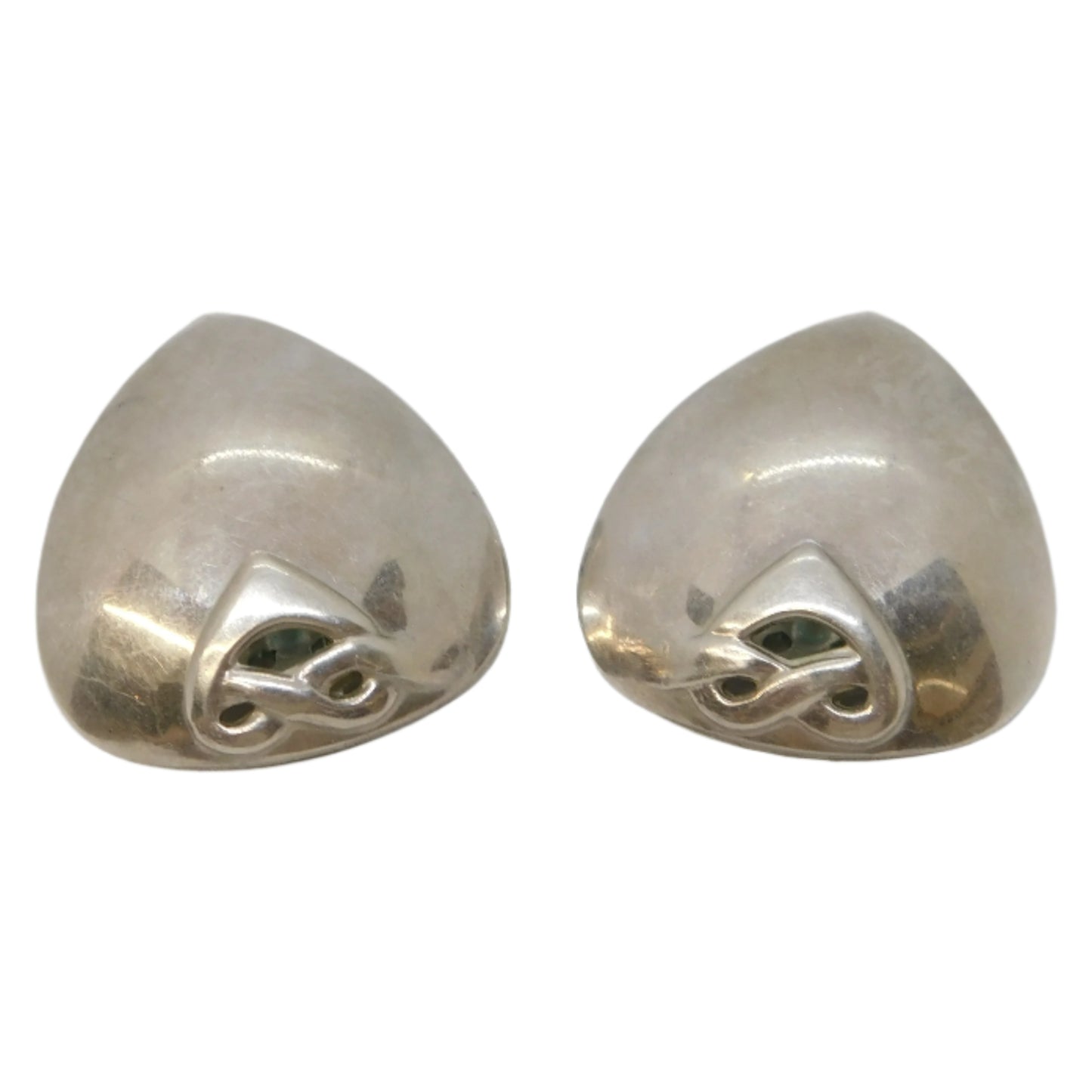 Pair of silver earrings on a light gray background