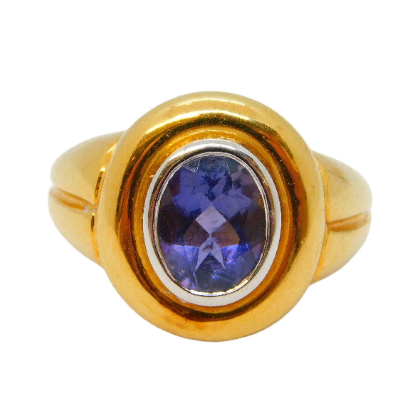 Gold ring with a purple gemstone on a white background