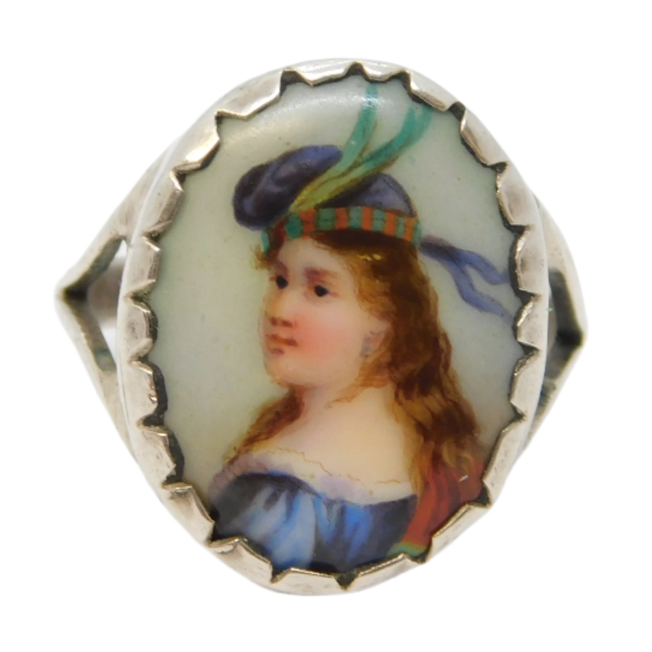 Ring with a portrait miniature of a woman wearing a decorative headpiece on a white background