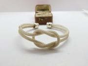 Sterling Silver Modernist Textured Lovers Knot Form Bangle Bracelet Vintage