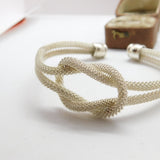 Sterling Silver Modernist Textured Lovers Knot Form Bangle Bracelet Vintage