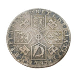 Old silver coin with intricate designs on a white background