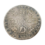 Old silver coin with intricate designs on a white background