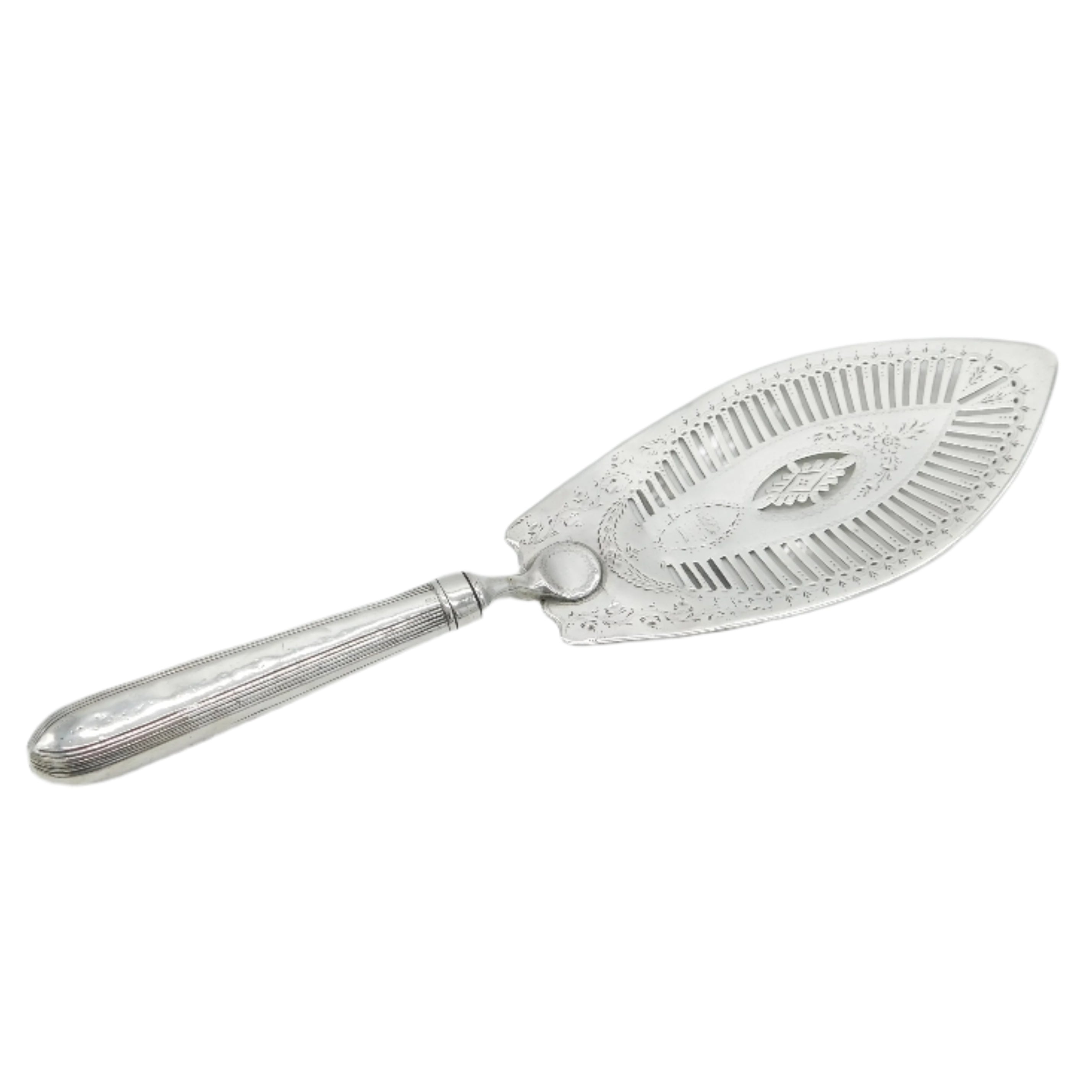 Silver cake server with decorative handle on a light gray background