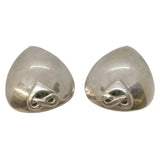 Pair of silver earrings on a light gray background