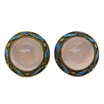 Pair of vintage earrings with pink stones on a white background