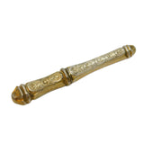 Decorative gold object on a white background