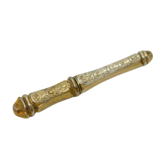 Decorative gold object on a white background