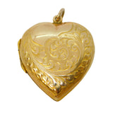 Gold heart-shaped locket on a white background