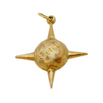 Gold-colored spiky pendant on a white background