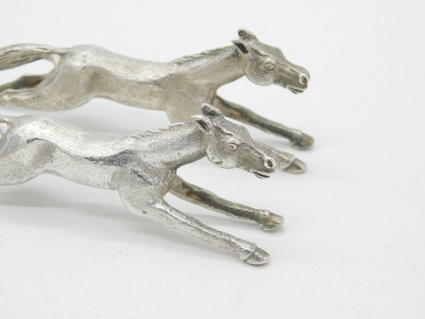 Pair of Cast Britannia Grade Silver Galloping Horse Knife Rests Antique c1930