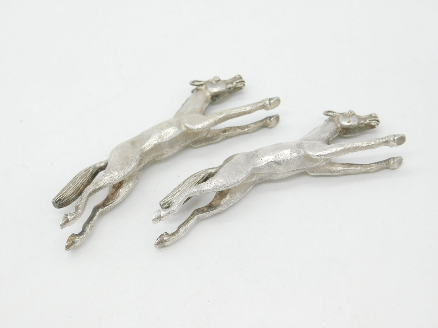 Pair of Cast Britannia Grade Silver Galloping Horse Knife Rests Antique c1930