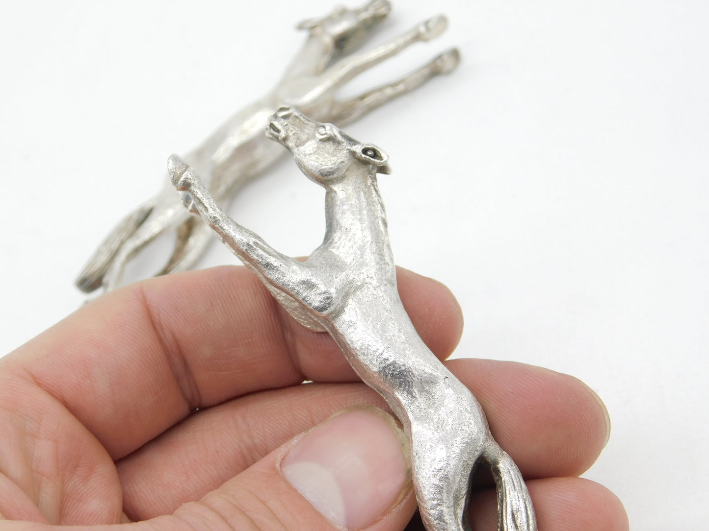 Pair of Cast Britannia Grade Silver Galloping Horse Knife Rests Antique c1930