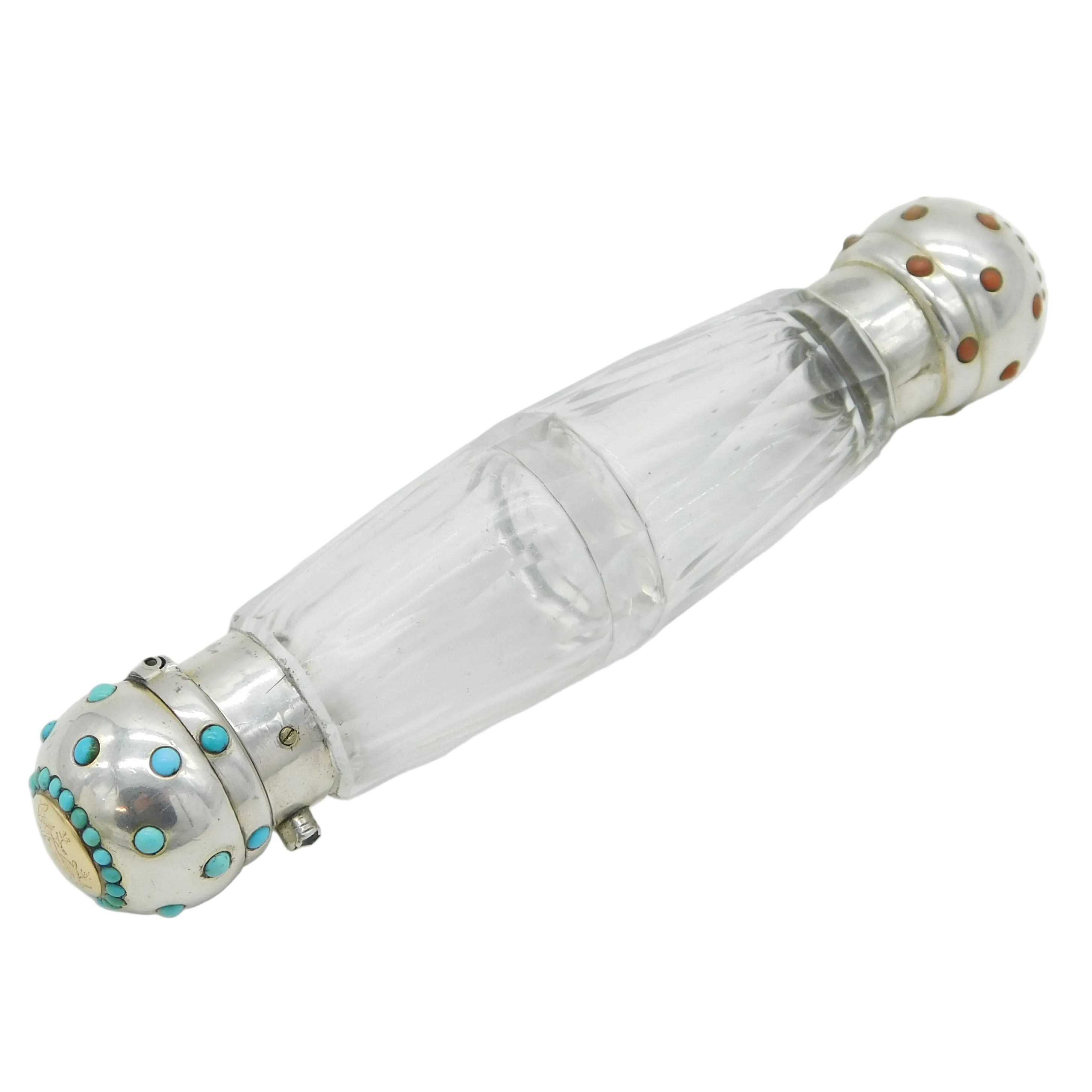 Clear glass bottle with silver and turquoise accents on a white background
