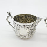 Pair Victorian Sterling Silver Cupid, Floral, Mythic Cream Jugs Antique 1900