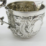 Pair Victorian Sterling Silver Cupid, Floral, Mythic Cream Jugs Antique 1900