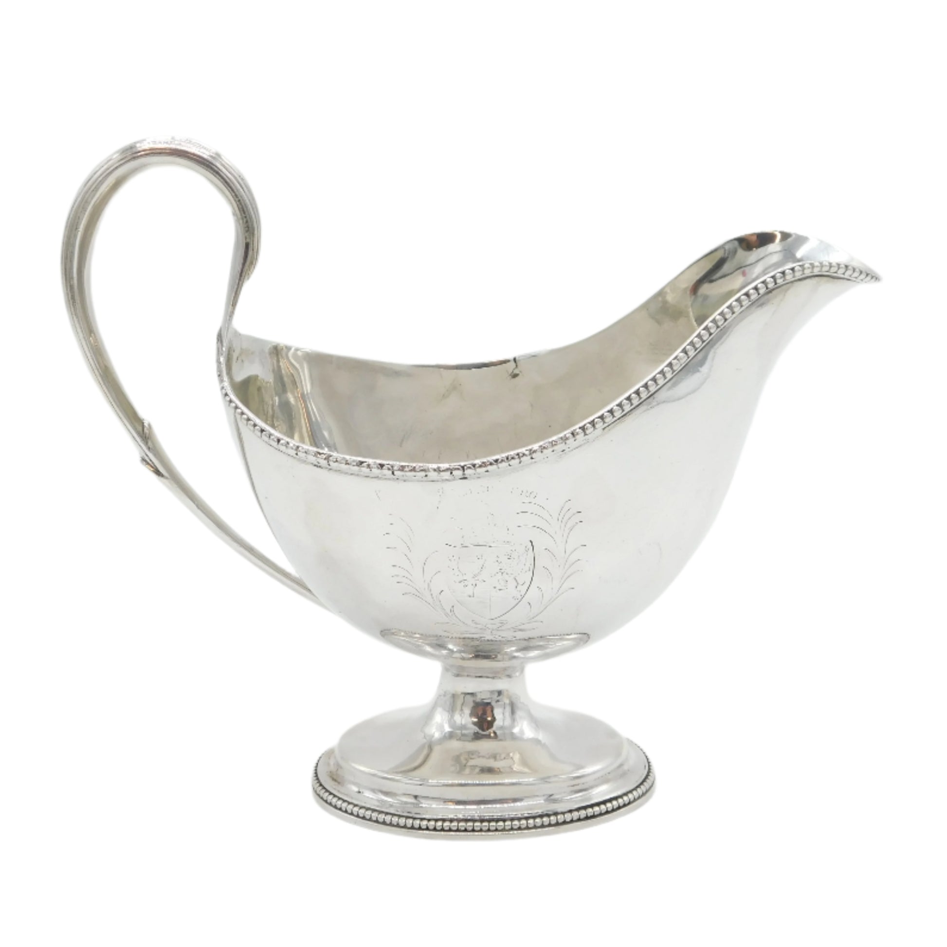 Silver gravy boat on a white background
