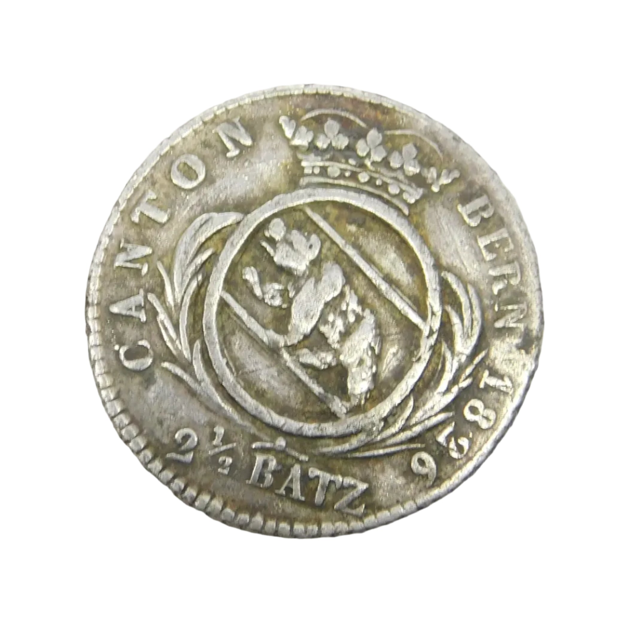 An antique Georgian Swiss sterling silver coin from the Bern Canton, shown resting on a white textured surface, with a visible date below the image.