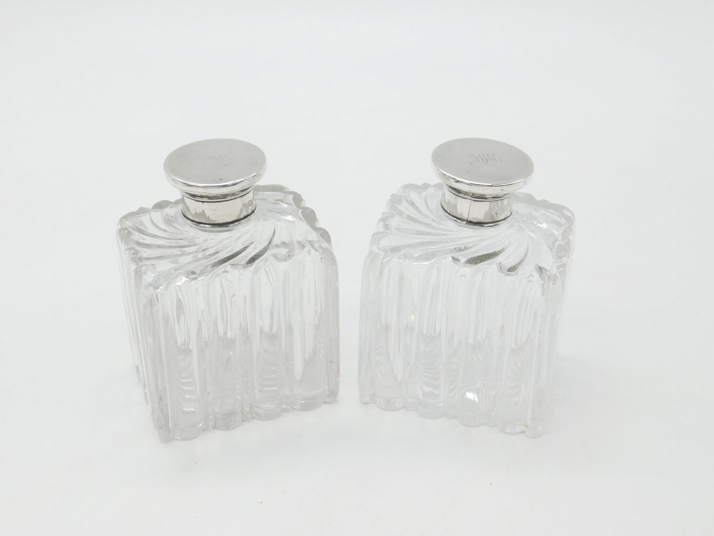 Pair of Victorian Sterling Silver Topped Swirling Glass Perfume Bottles c1850