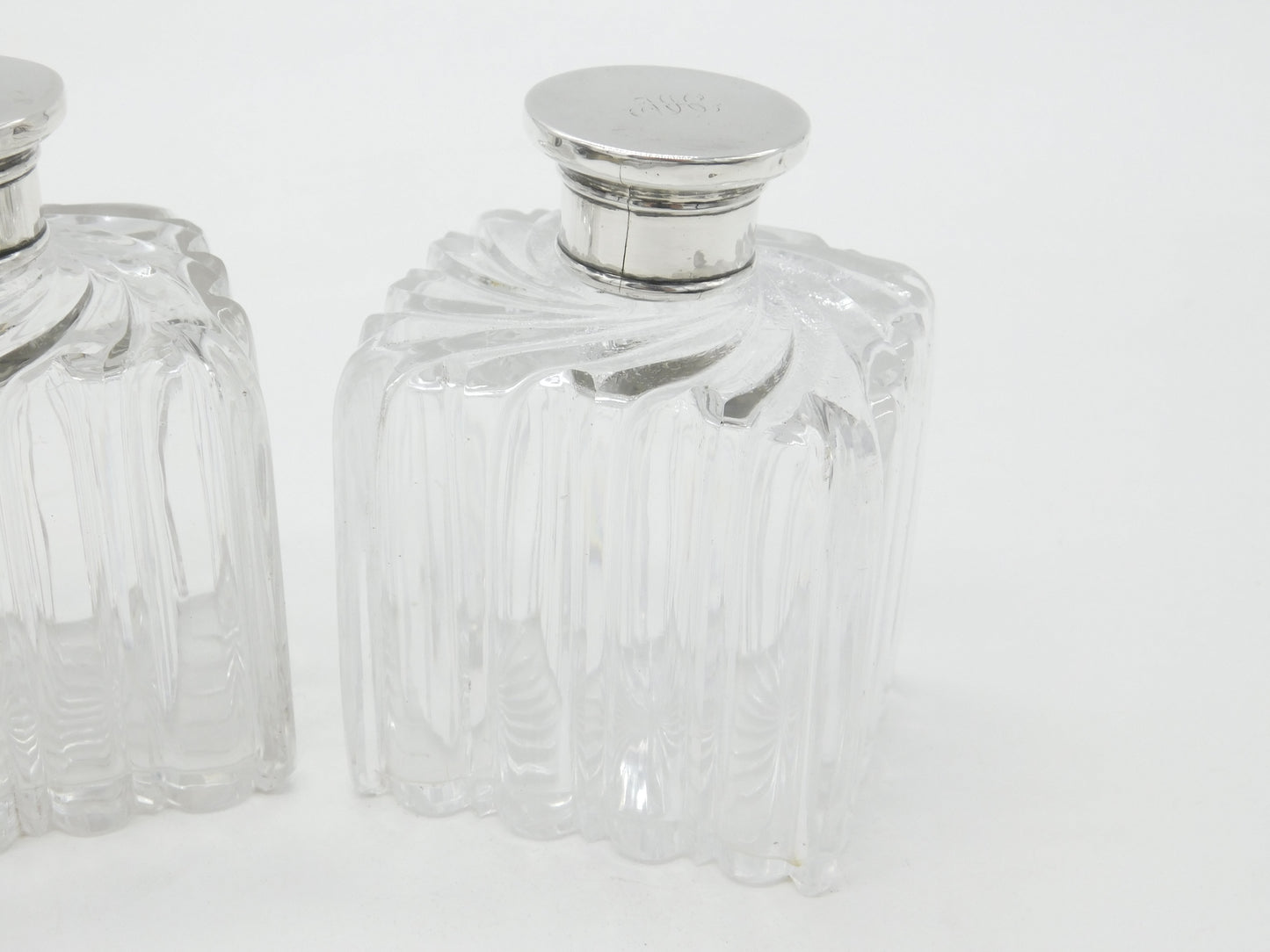 Pair of Victorian Sterling Silver Topped Swirling Glass Perfume Bottles c1850