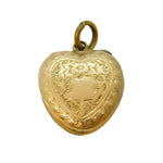 Gold heart-shaped locket on a white background