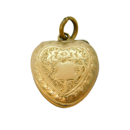 Gold heart-shaped locket on a white background