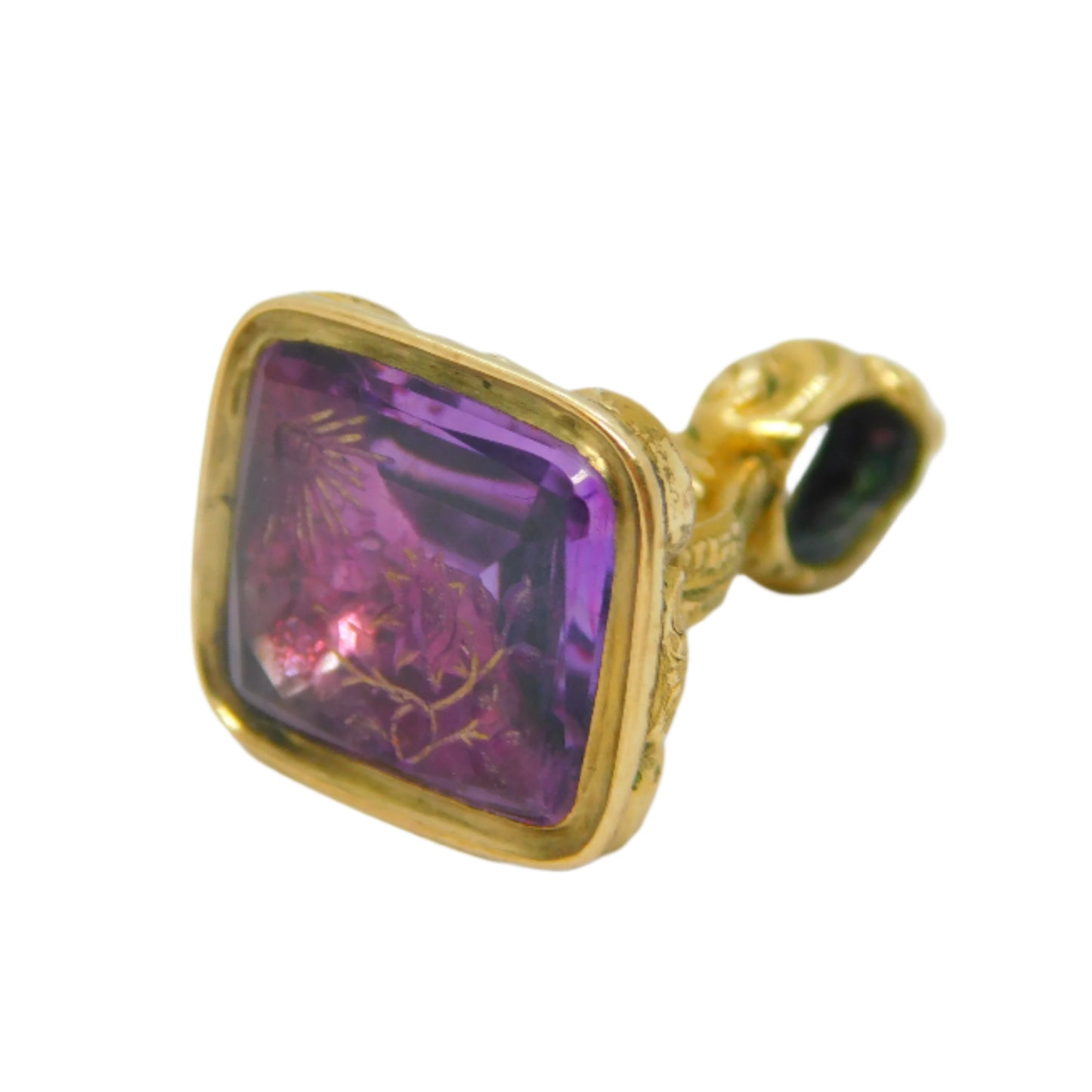 Gold pendant with a purple gemstone on a white background