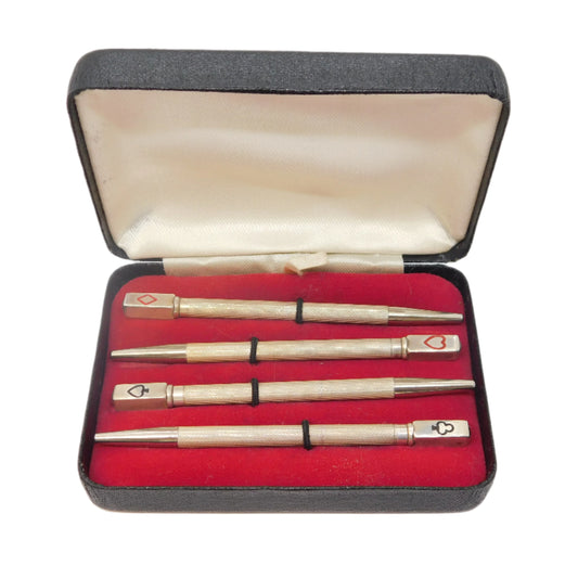 Set of three pens in a red-lined case on a white background