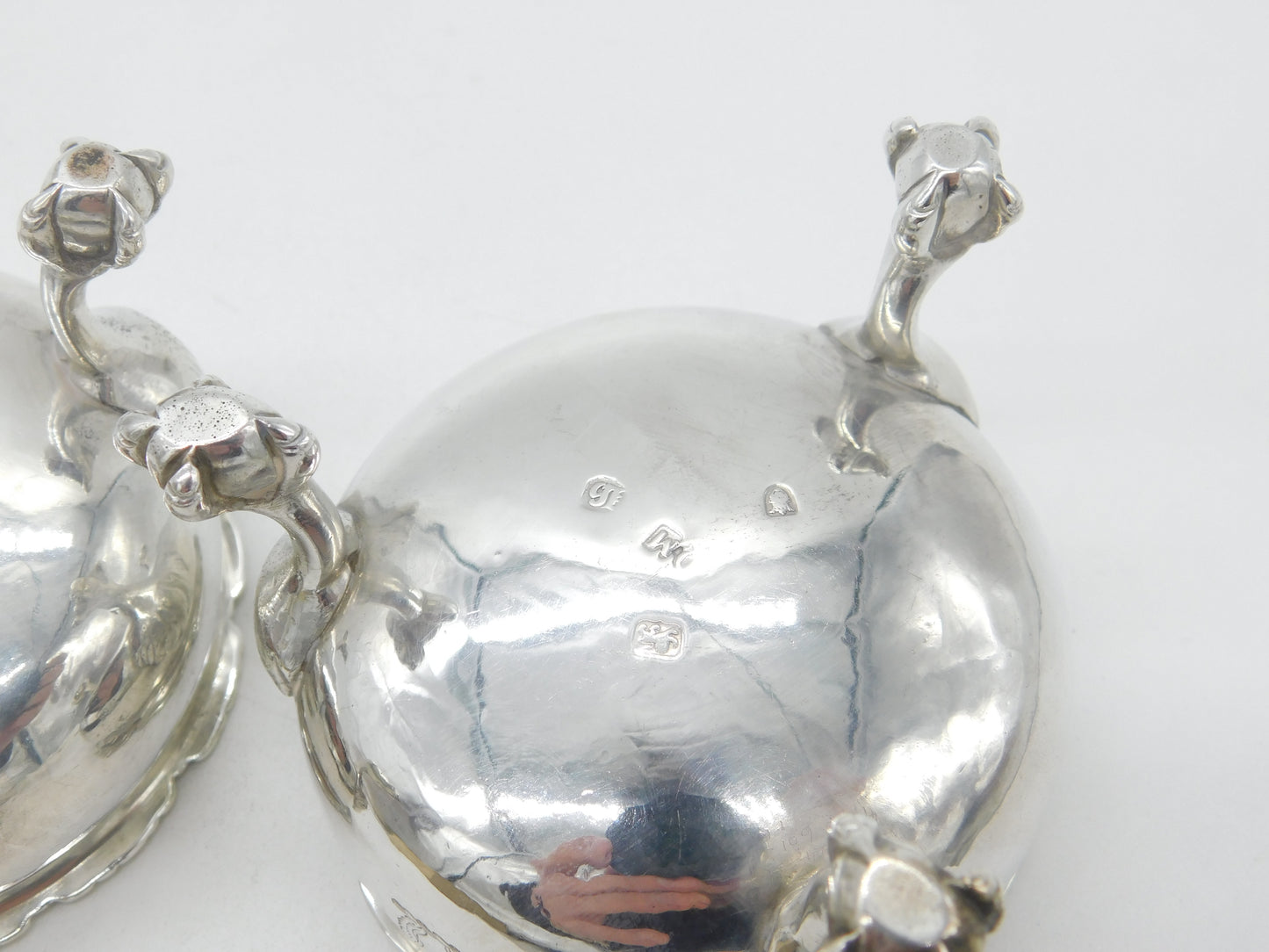 Pair of Georgian Sterling Silver Paw Foot Crested Salt Cellars 1763 London