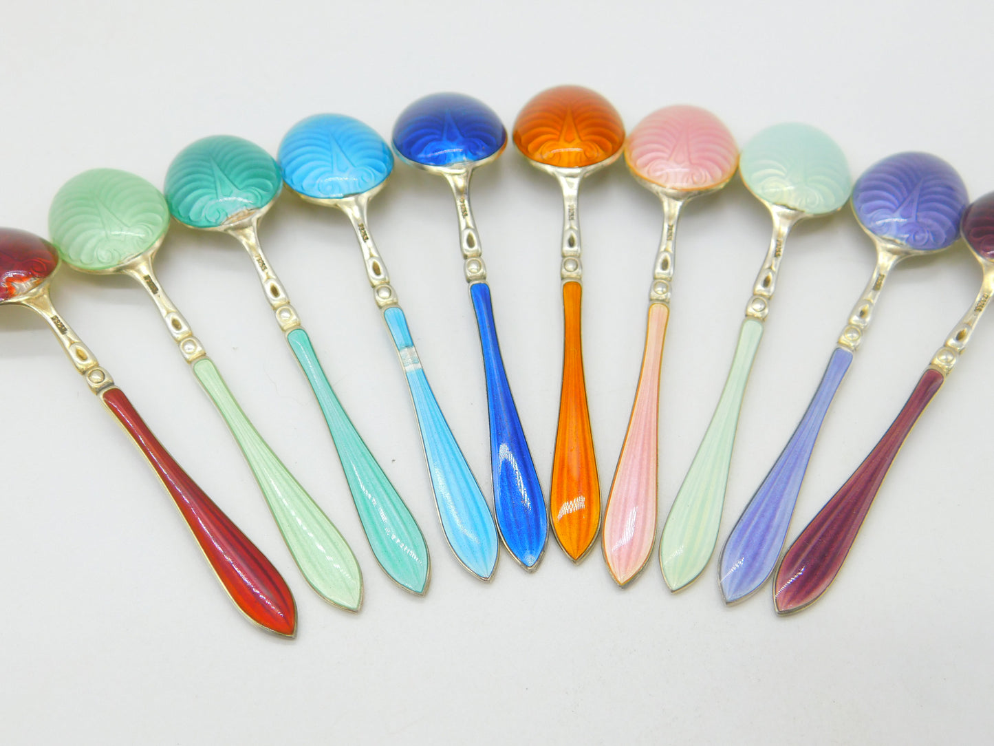 Set of Ten Scandinavian Sterling Silver Rainbow Guilloche Enamel Teaspoons c1920