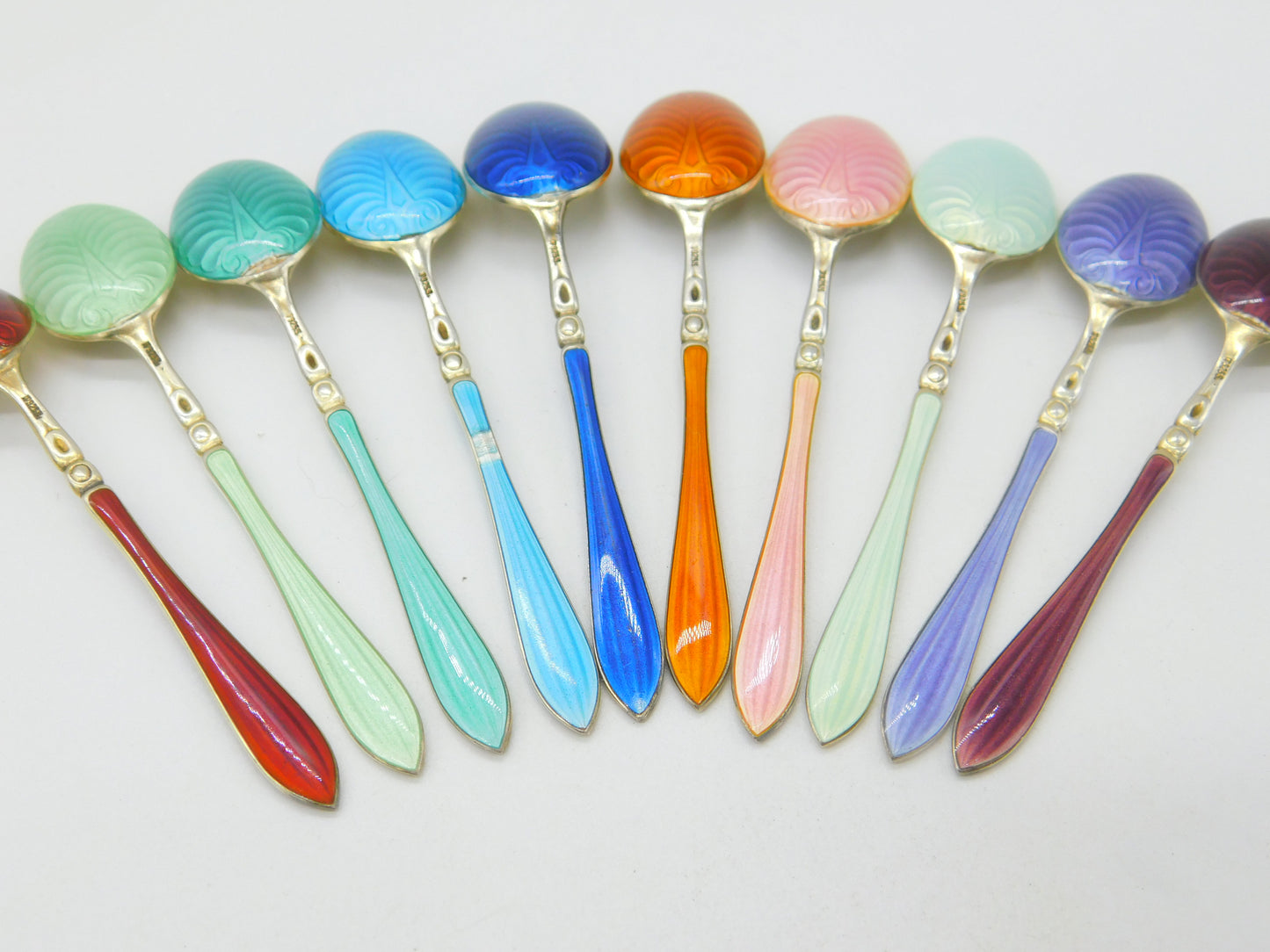 Set of Ten Scandinavian Sterling Silver Rainbow Guilloche Enamel Teaspoons c1920