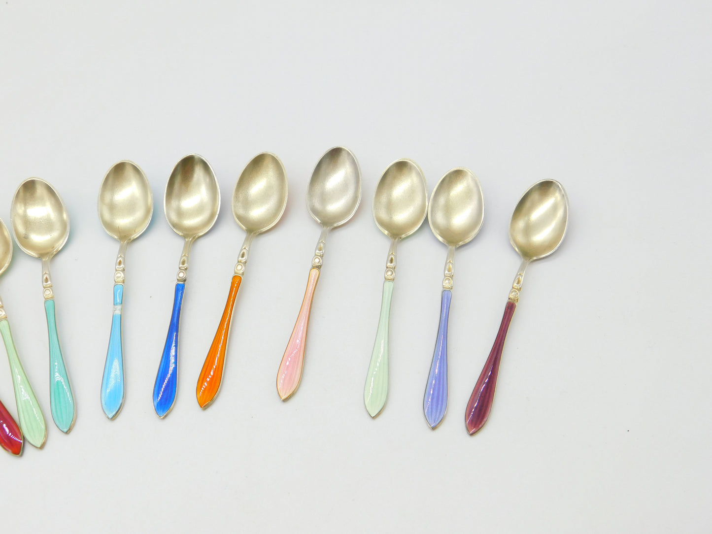 Set of Ten Scandinavian Sterling Silver Rainbow Guilloche Enamel Teaspoons c1920