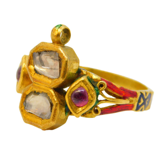 Gold ring with gemstones on a white background
