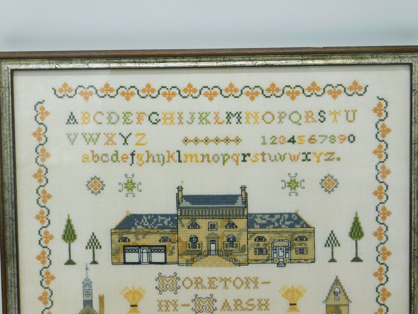 Framed Needlework Wool Sampler of 'The Horns Family Home in Moreton-In-Marsh'