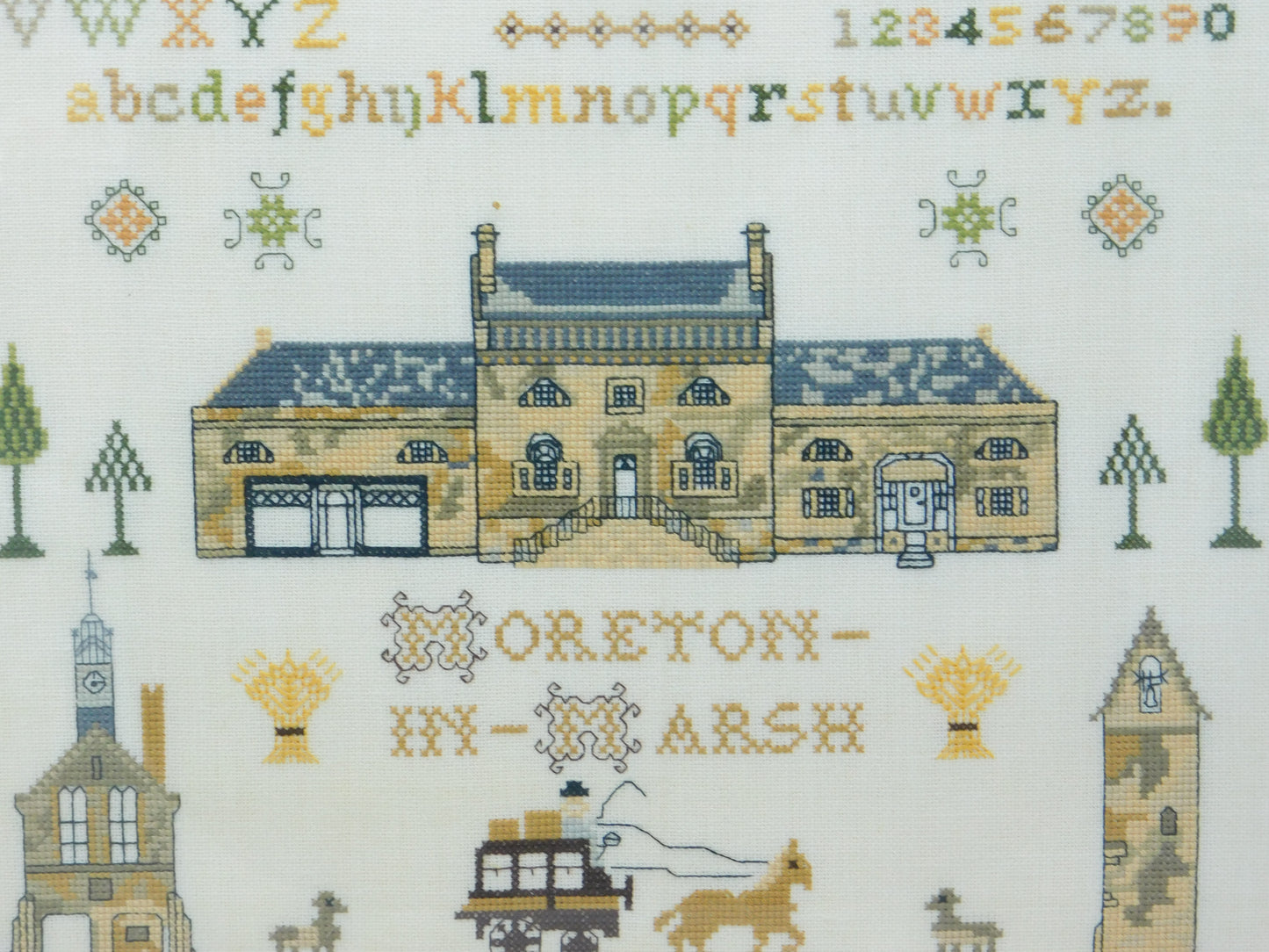 Framed Needlework Wool Sampler of 'The Horns Family Home in Moreton-In-Marsh'